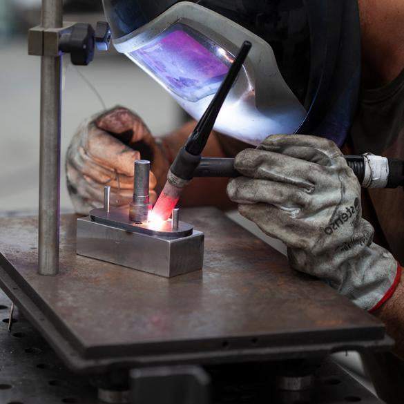 Crafting a metal hanger in the workshop